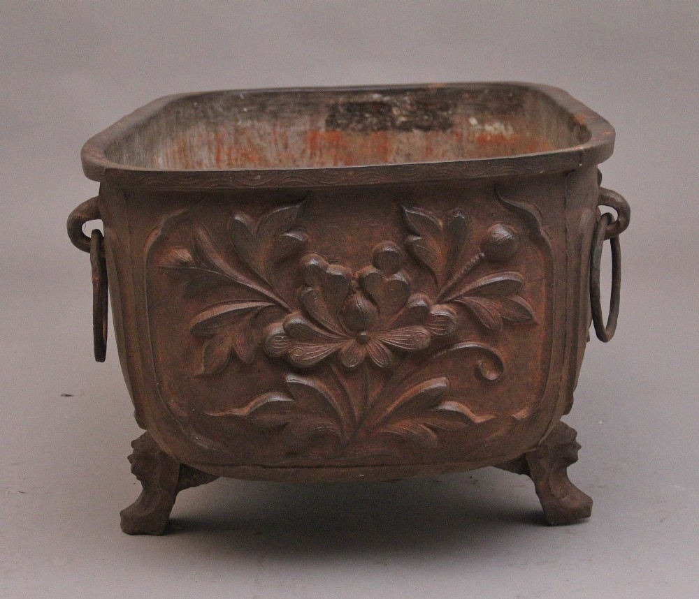 An early nineteenth-century Chinese cast iron temple bath featuring raised floral carvings, side ring handles, and lion mask feet. View IV
