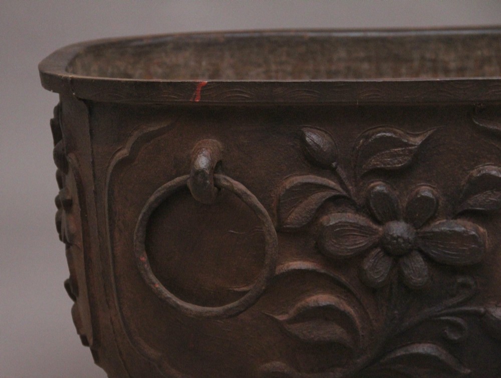 An early nineteenth-century Chinese cast iron temple bath featuring raised floral carvings, side ring handles, and lion mask feet. View VIII