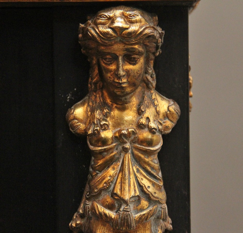 A 19th-century ebonised two-door cabinet featuring detailed brass Boulle marquetry panels, classical female caryatid mounts, and gilt-bronze mouldings. View VII