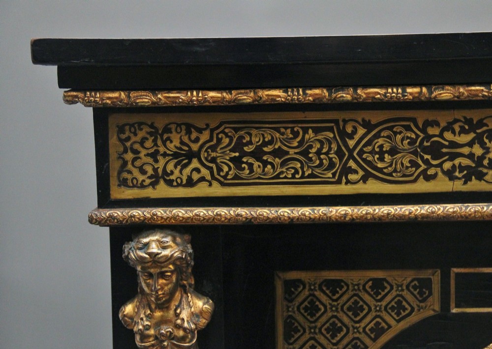 A 19th-century ebonised two-door cabinet featuring detailed brass Boulle marquetry panels, classical female caryatid mounts, and gilt-bronze mouldings. View XI