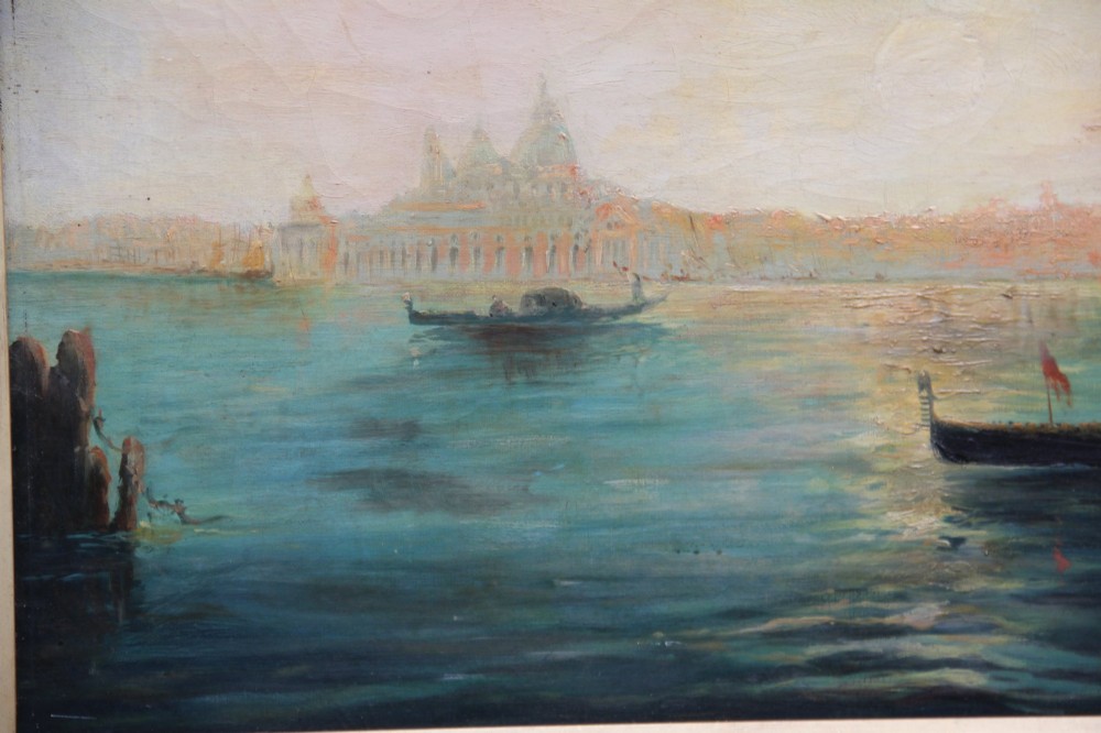 An early 20th-century oil painting depicting gondolas and ships on the Venetian lagoon, set within an ornate gilded frame. View IV