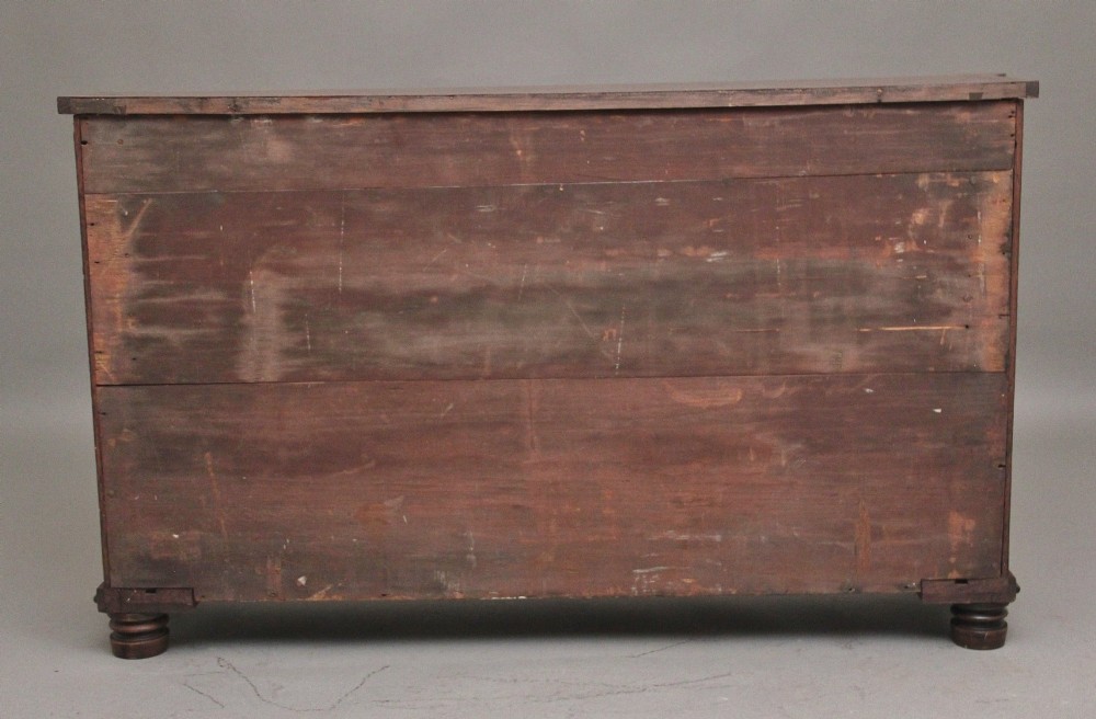 An early 19th-century Regency pollard oak side cabinet featuring two brass lattice grille doors, ebony stringing, and turned flanking columns. View VI