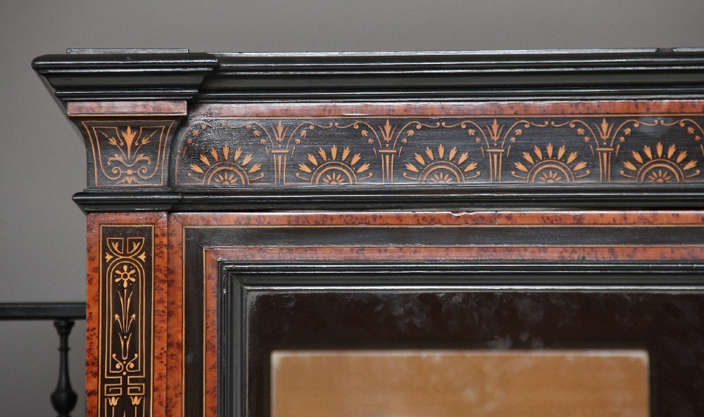 A large Victorian ebonised and walnut display cabinet with marquetry inlays, central glazed doors, and turned columns. View XII