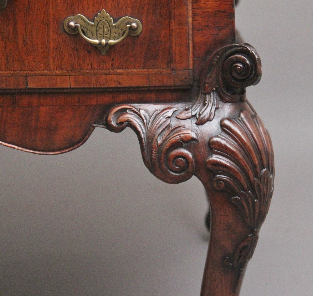A 19th-century walnut writing desk featuring multiple drawers with brass hardware, a shaped apron, and carved cabriole legs with ball-and-claw feet. View VIII