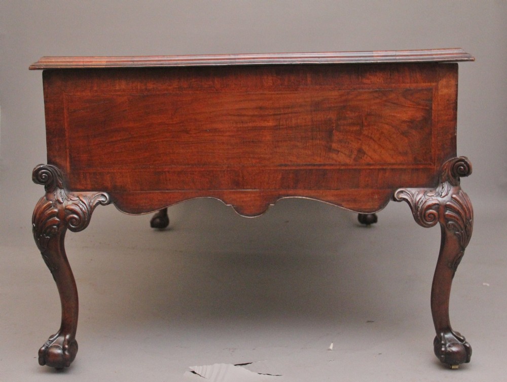 A 19th-century walnut writing desk featuring multiple drawers with brass hardware, a shaped apron, and carved cabriole legs with ball-and-claw feet. View XII