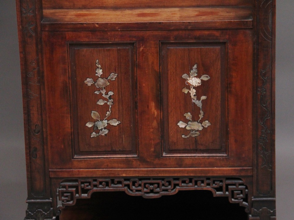 A dark brown 19th-century French Japonisme shodona display cabinet featuring mother-of-pearl inlays, asymmetrical shelves, and a carved pagoda crest with a dragon detail. View XII