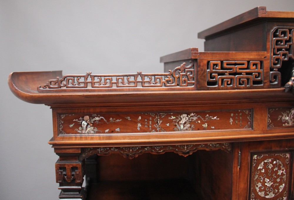 A dark brown 19th-century French Japonisme shodona display cabinet featuring mother-of-pearl inlays, asymmetrical shelves, and a carved pagoda crest with a dragon detail. View XIII