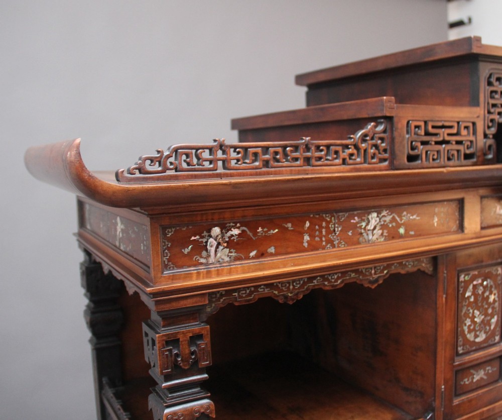 A dark brown 19th-century French Japonisme shodona display cabinet featuring mother-of-pearl inlays, asymmetrical shelves, and a carved pagoda crest with a dragon detail. View XIV
