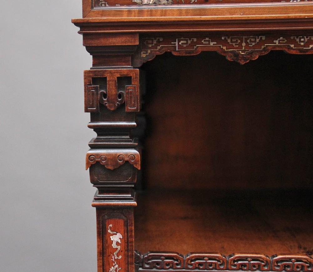 A dark brown 19th-century French Japonisme shodona display cabinet featuring mother-of-pearl inlays, asymmetrical shelves, and a carved pagoda crest with a dragon detail. View XV