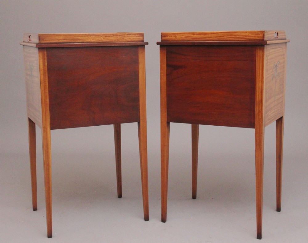 A pair of tall early 20th-century satinwood bedside cabinets featuring hand-painted classical figural medallions and tapered square legs. View VIII