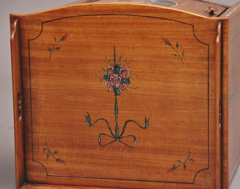 A pair of tall early 20th-century satinwood bedside cabinets featuring hand-painted classical figural medallions and tapered square legs. View XI