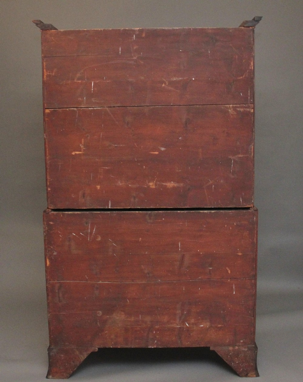 An early nineteenth-century mahogany bow-front tallboy featuring seven stacked drawers with turned brass handles. View XI