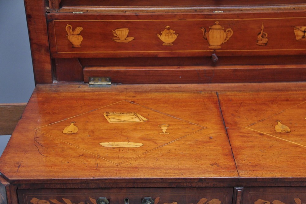 An early 19th-century Dutch mahogany travelling cabinet with intricate floral marquetry inlay, twin drawers over a two-door cupboard, and metal side carrying handles. View XIV