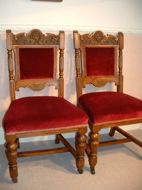 A Pair of Carved Oak Victorian Chairs