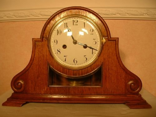 Scroll Shaped Oak Mantle Clock.