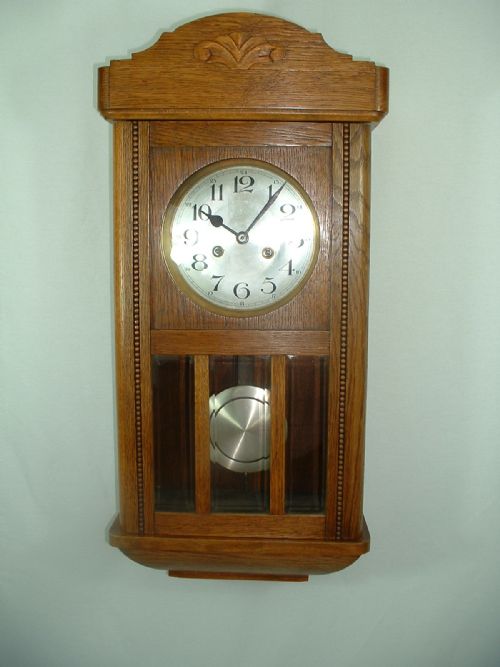 Arts & Crafts Striking Wall Clock.