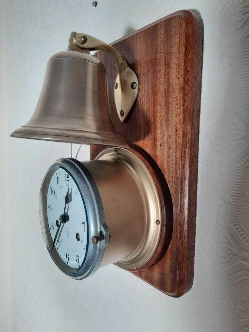 Mounted Ships Clock Striking 8 Bells of the Watch