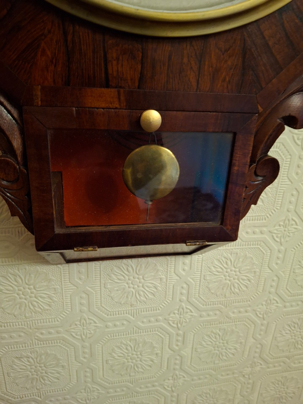 Victorian octagonal drop-dial wall clock crafted from dark rosewood with a brass-bezel white dial and Roman numerals. View III