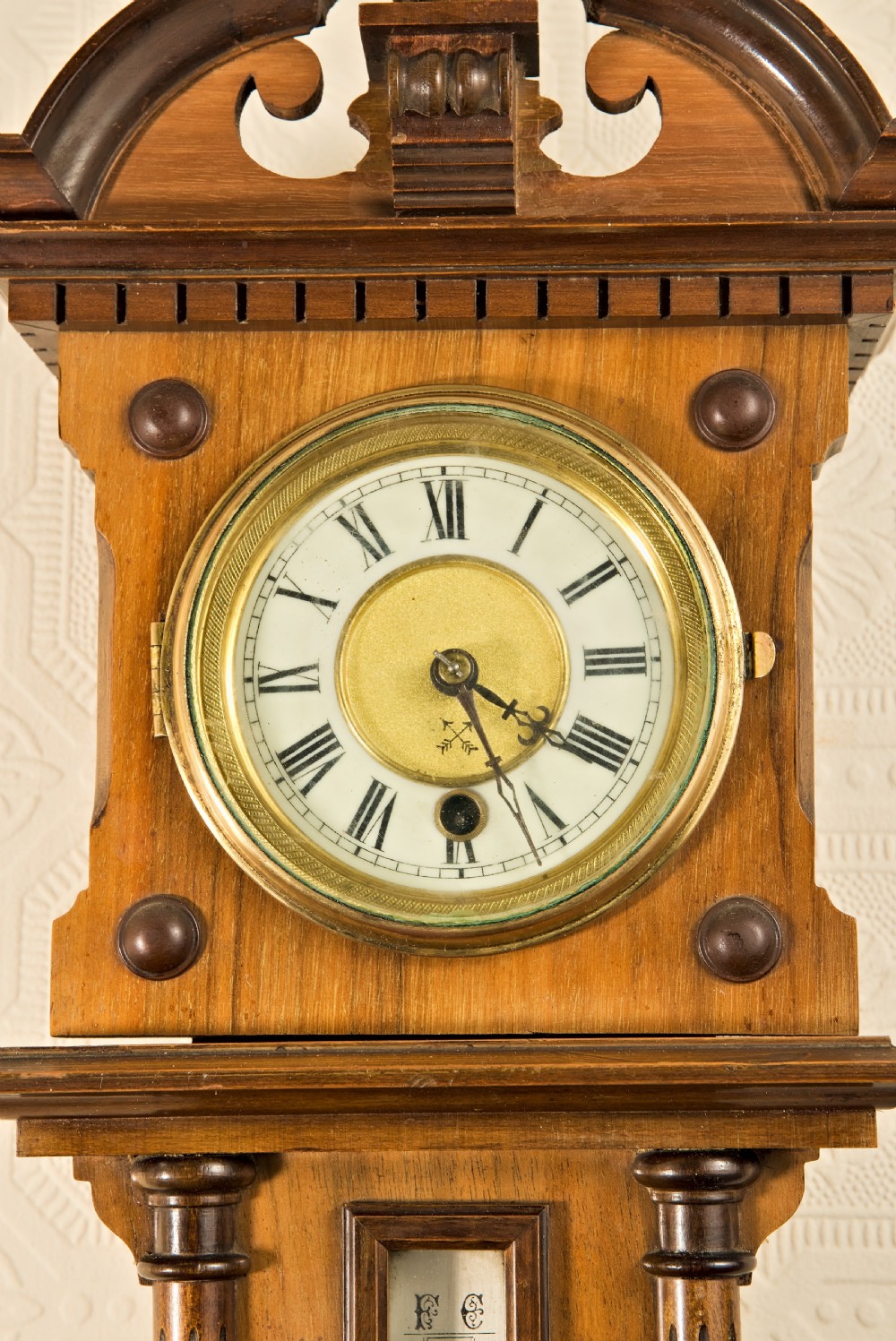 A wall-hung antique walnut clock, thermometer, and aneroid barometer companion set featuring carved pediment ornamentation and brass-rimmed dials. View III