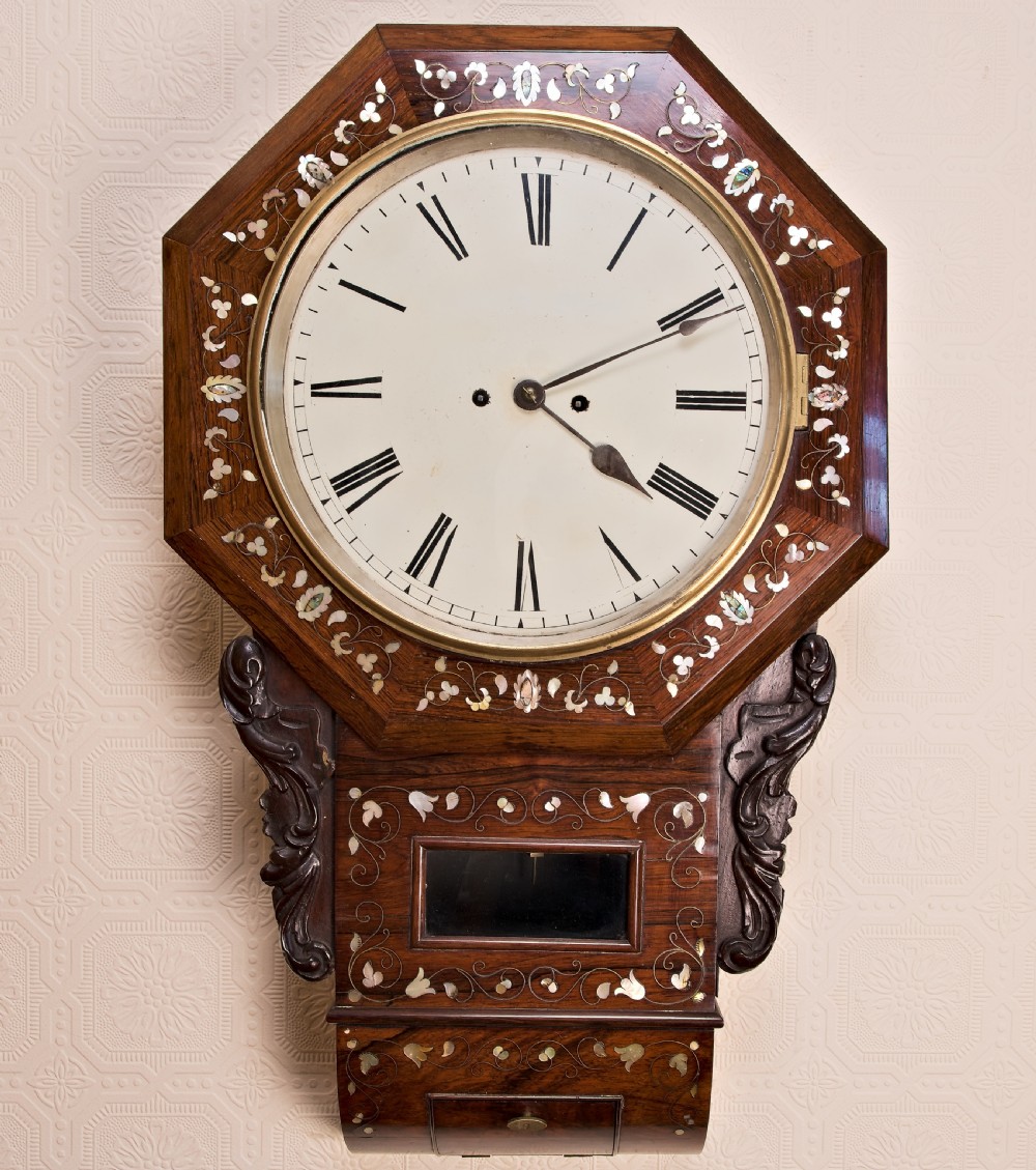Victorian octagonal drop-dial wall clock crafted in rosewood with intricate mother-of-pearl floral inlay and a white Roman numeral dial.