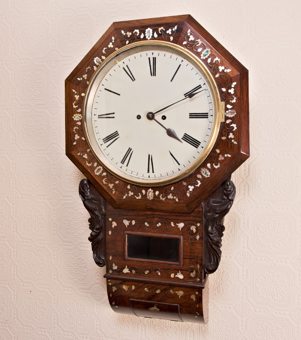 Victorian octagonal drop-dial wall clock crafted in rosewood with intricate mother-of-pearl floral inlay and a white Roman numeral dial. View XII