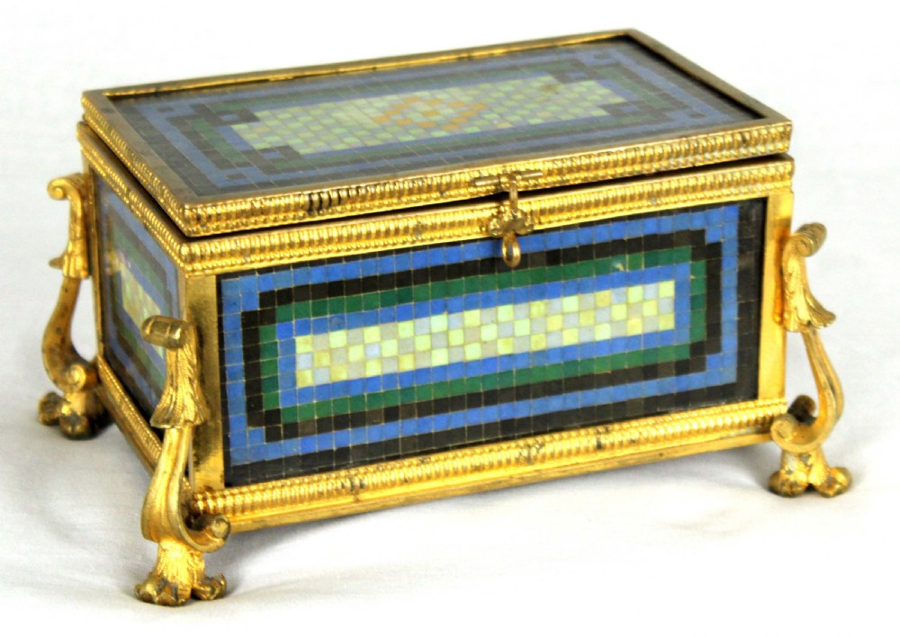 A Late 19th Century Italian Micro Mosaic and Ormolu box with red-lined interior.