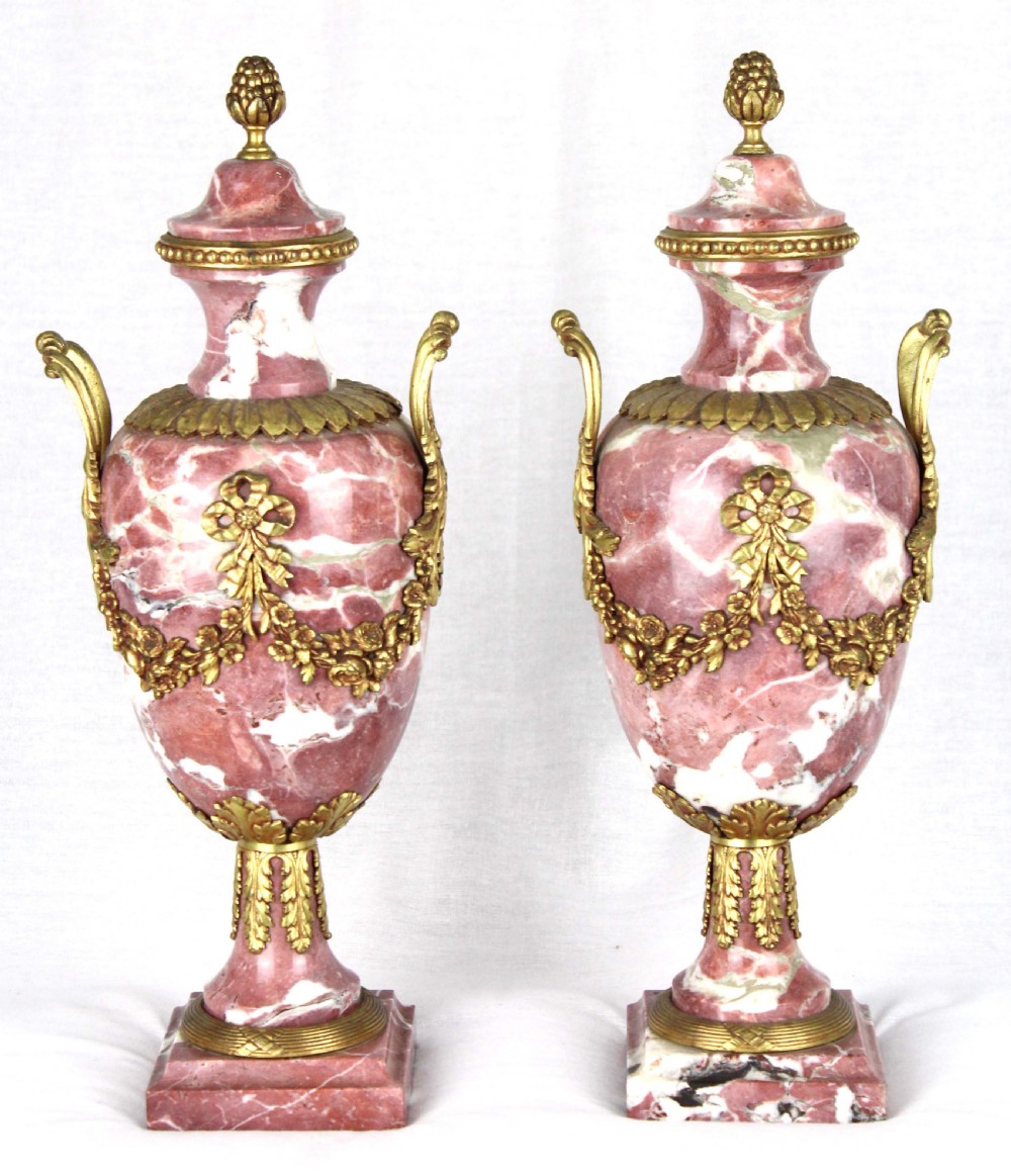 A pair of late 19th c rouge marble and ormolu mounted Cassolettes with acorn finial.