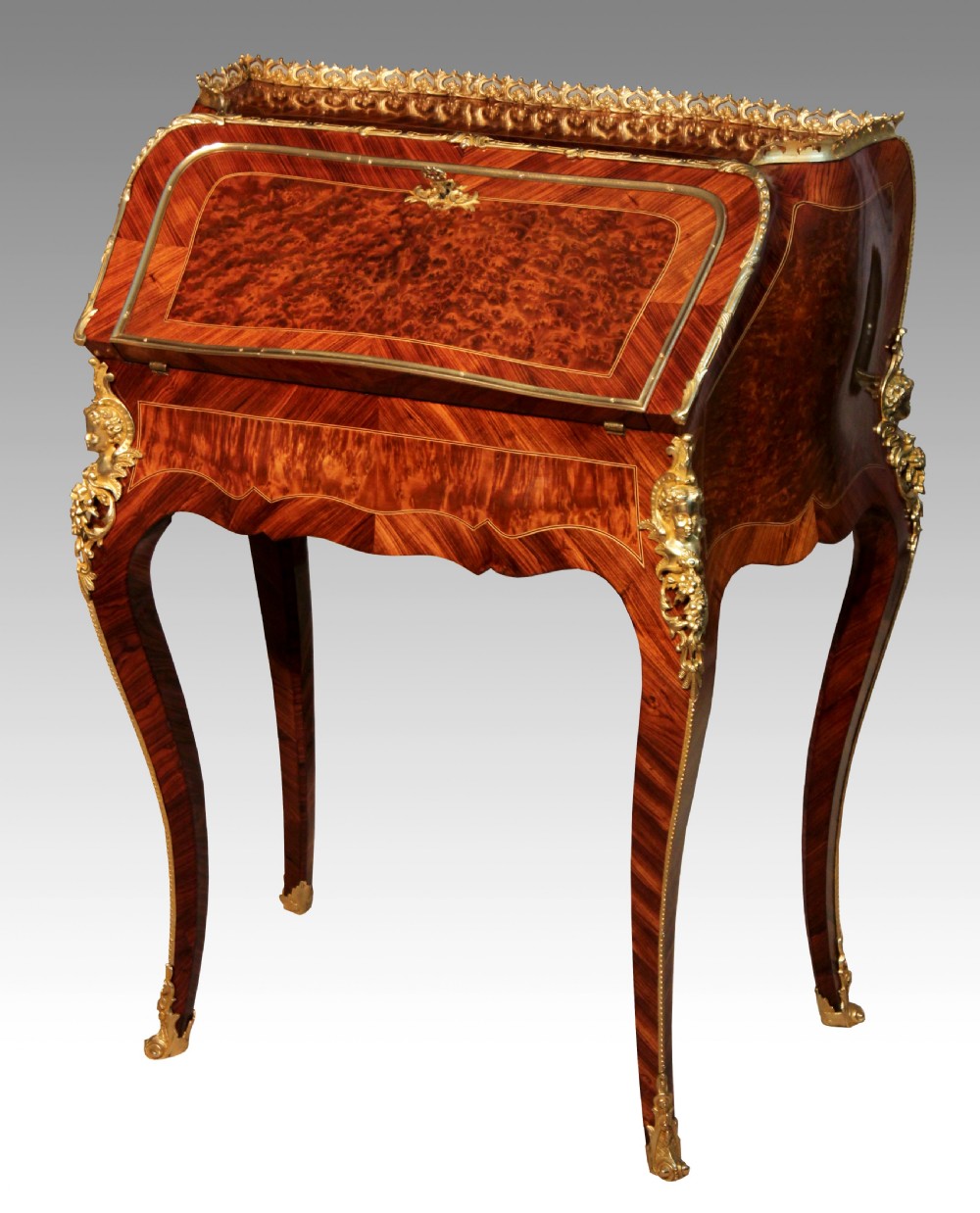 An Exceptionally Fine Quality Burr walnut inlaid and ormolu mounted bureau de dame.