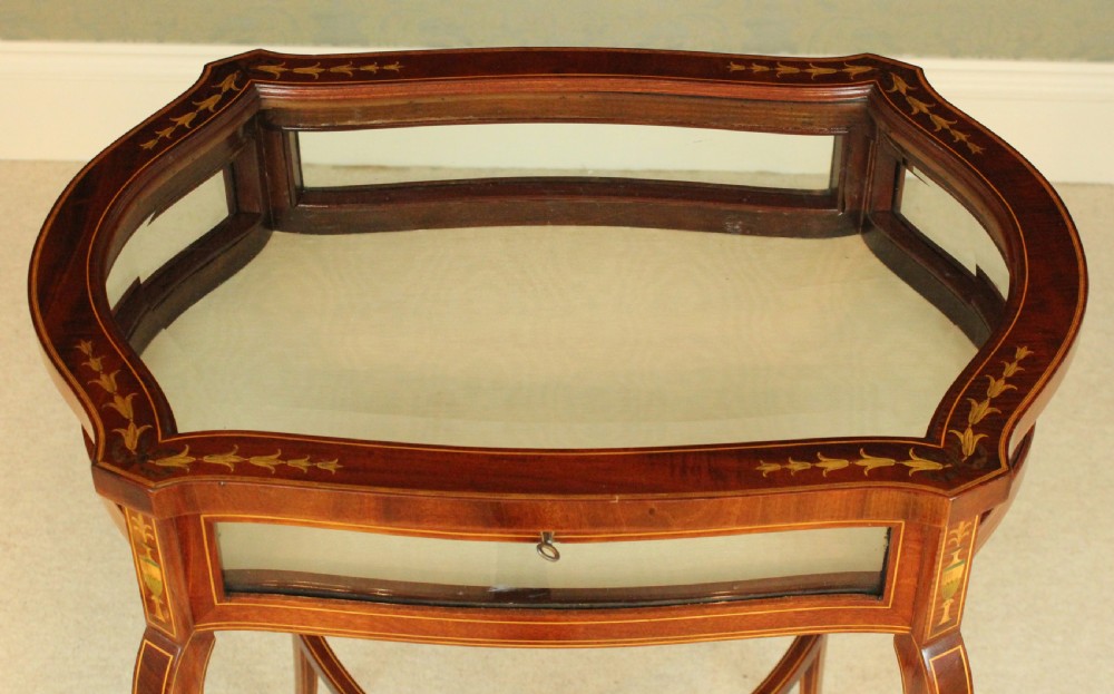 A Fine quality late Victorian mahogany inlaid serpentine shaped bijouterie table View III