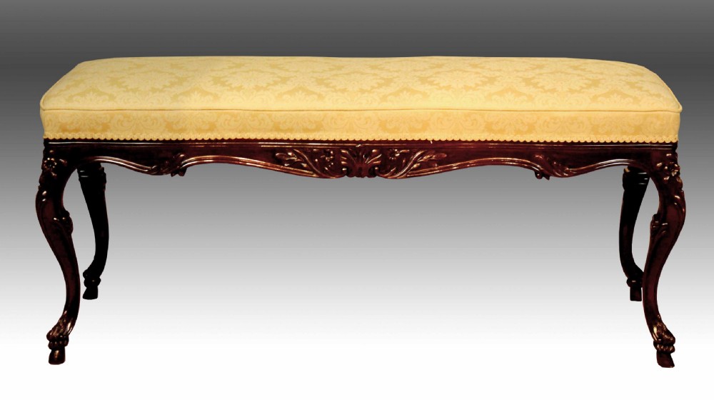 A mahogany Late Victorian Period stool by Edwards & Roberts of London.
