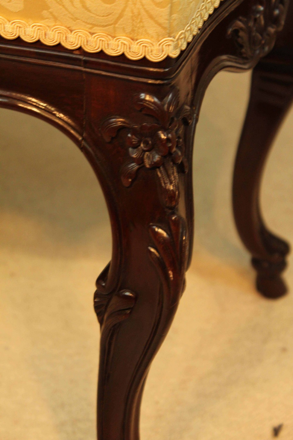A mahogany Late Victorian Period stool by Edwards & Roberts of London. View VI