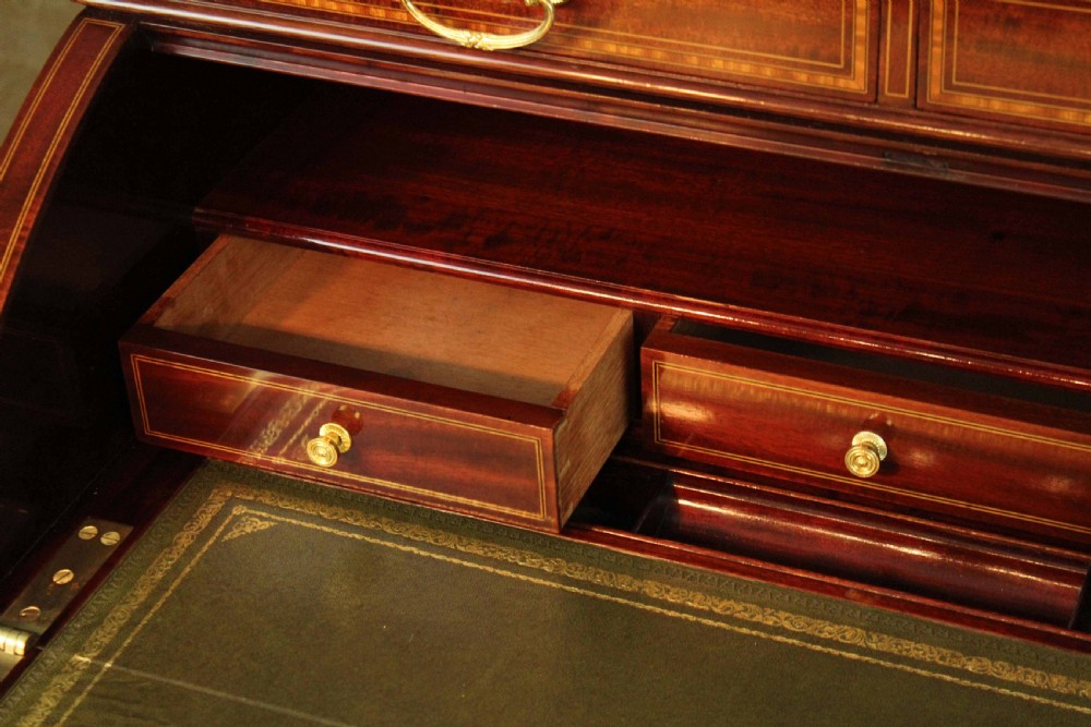 A Beautiful Late Victorian Mahogany cylinder desk by Maple & Co. View XV