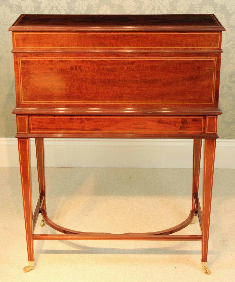 A Beautiful Late Victorian Mahogany cylinder desk by Maple & Co. View XVIII