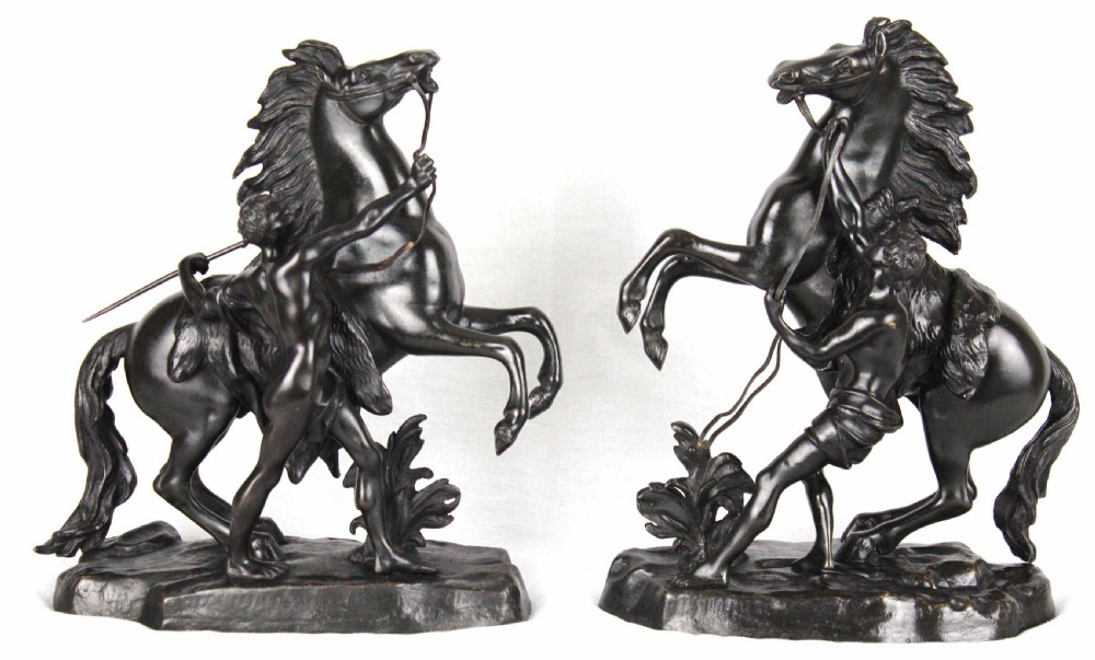 A fine pair of 19th Century Bronze Marley horses with figures.