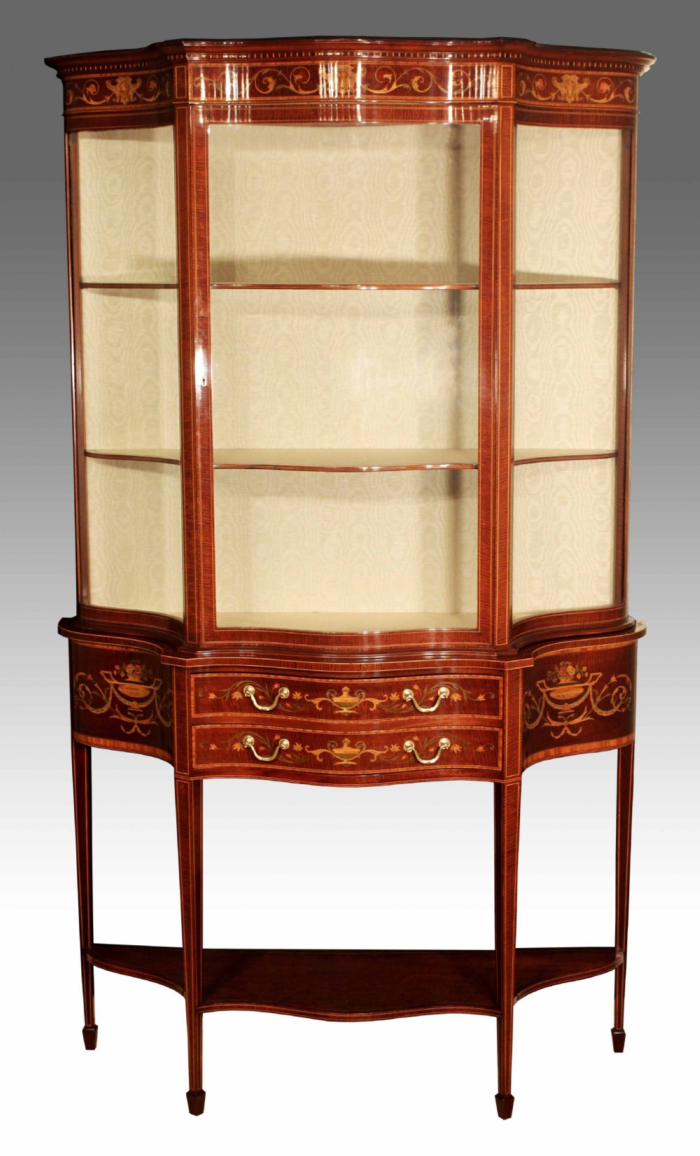 An Exhibition Quality Late Victorian Mahogany Inlaid Serpentine Display Cabinet By Maple & Co