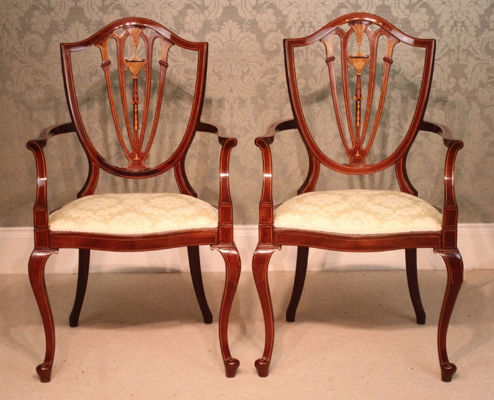 A Fine Pair of Late Victorian Mahogany inlaid shield back ladies and gents armchairs by Edwards & Roberts. View II