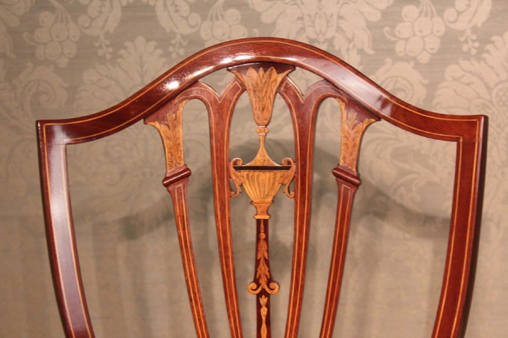 A Fine Pair of Late Victorian Mahogany inlaid shield back ladies and gents armchairs by Edwards & Roberts. View IV