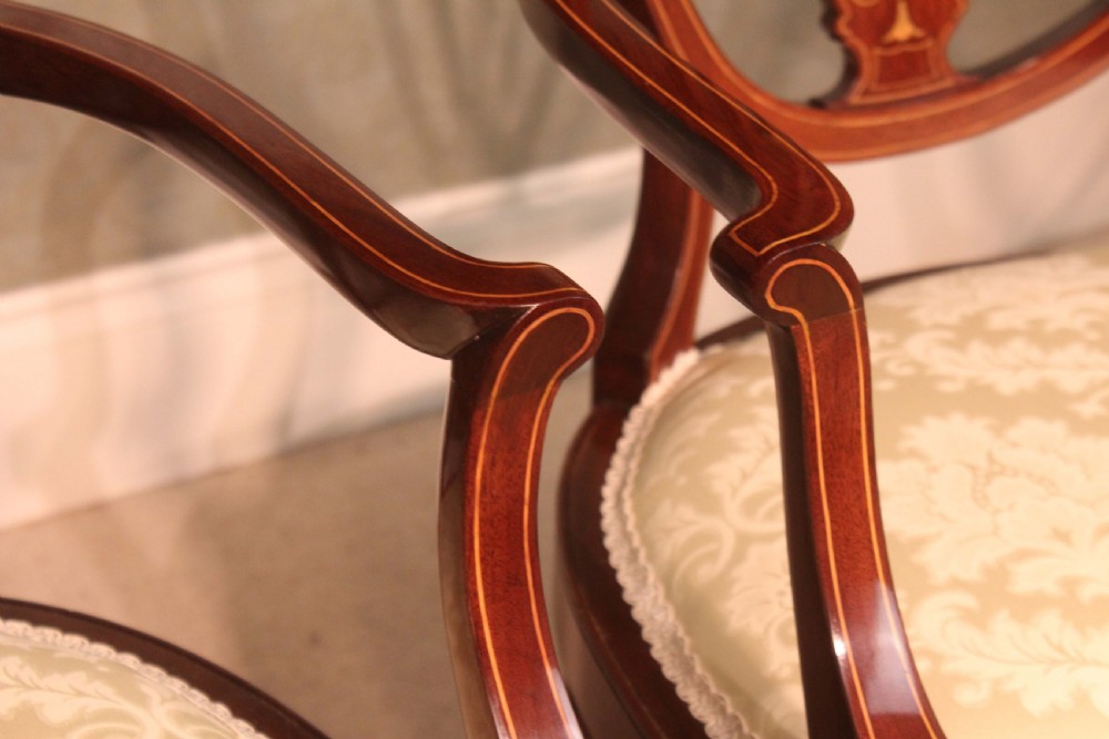 A Fine Pair of Late Victorian Mahogany inlaid shield back ladies and gents armchairs by Edwards & Roberts. View VI