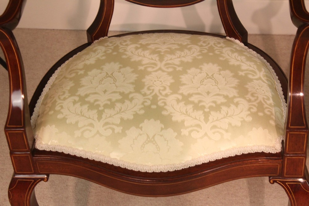 A Fine Pair of Late Victorian Mahogany inlaid shield back ladies and gents armchairs by Edwards & Roberts. View VII