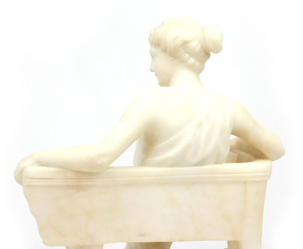 A 19th Century Marble sculpture modelled as a seated Maiden View IV