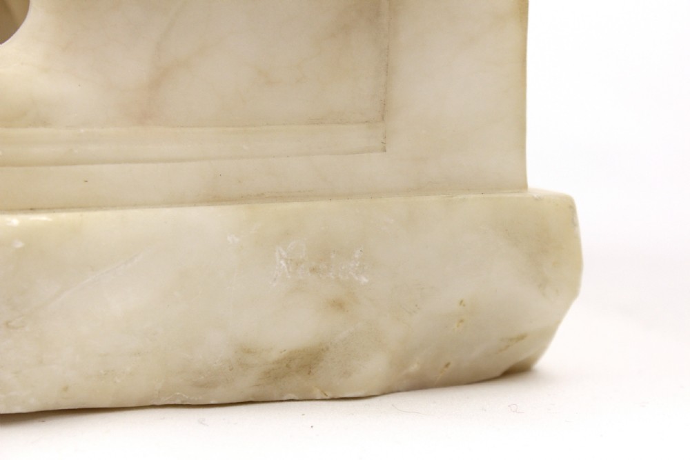 A 19th Century Marble sculpture modelled as a seated Maiden View V