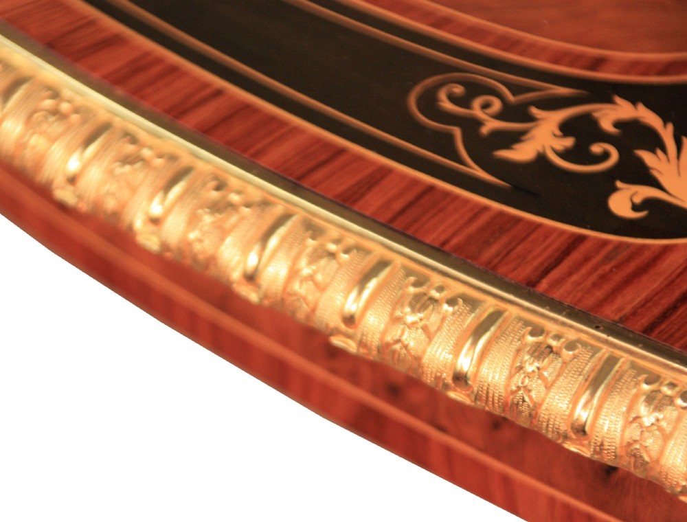 A Gillows Victorian Burr-walnut And Amboyna Mounted Centre Table View VII