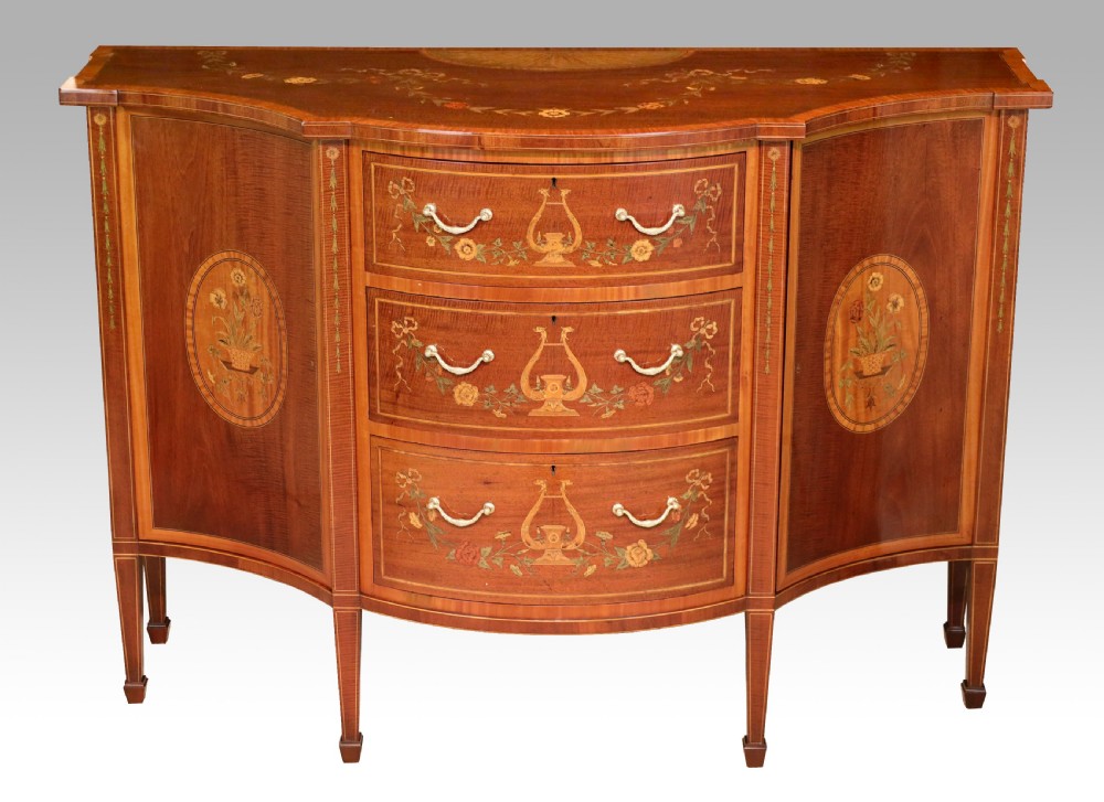 A Superb Late Victorian Mahogany Inlaid Serpentine Commode