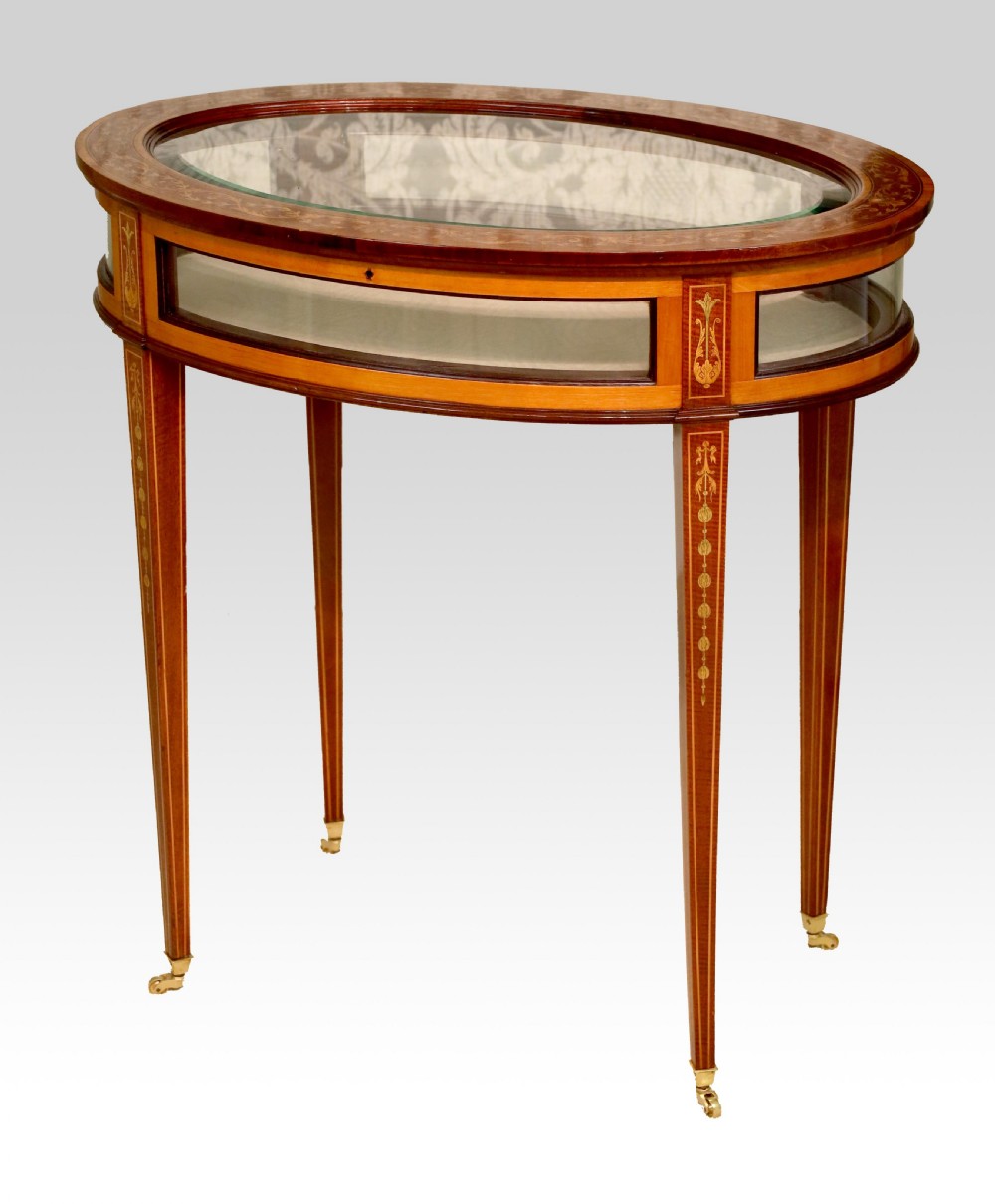 An Edwards & Roberts Victorian Mahogany Inlaid Oval Bijouterie Table