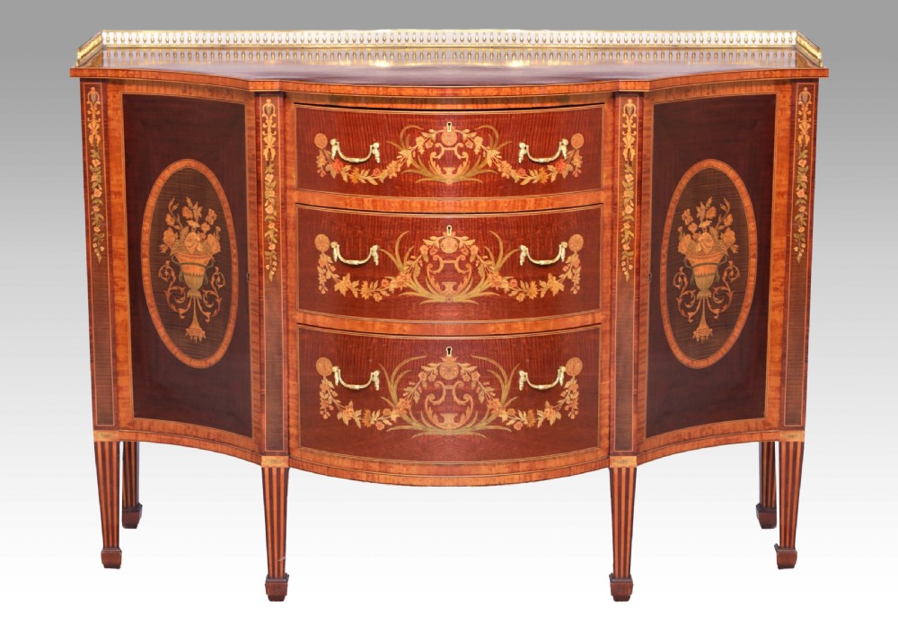 A Superb Late Victorian Mahogany Inlaid Serpentine Commode