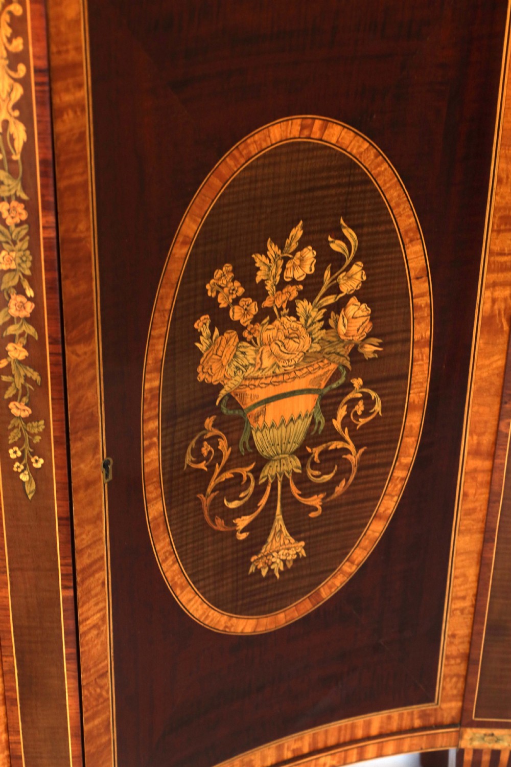 A Superb Late Victorian Mahogany Inlaid Serpentine Commode View VI