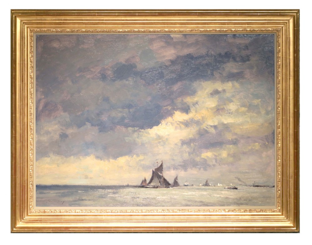 An original oil painting on canvas by Edward Seago depicting sailing boats on calm waters under a dramatic cloudy sky, presented in a molded gold frame.
