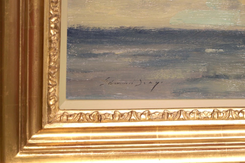An original oil painting on canvas by Edward Seago depicting sailing boats on calm waters under a dramatic cloudy sky, presented in a molded gold frame. View II