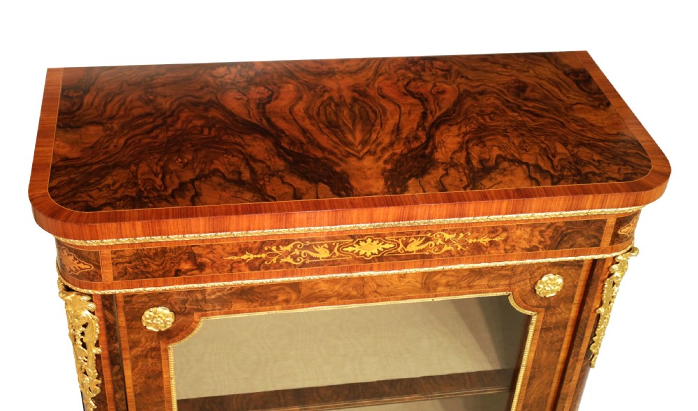 A pair of late nineteenth-century glazed display cabinets crafted from kingwood and walnut with decorative gilt-bronze mounts. View III