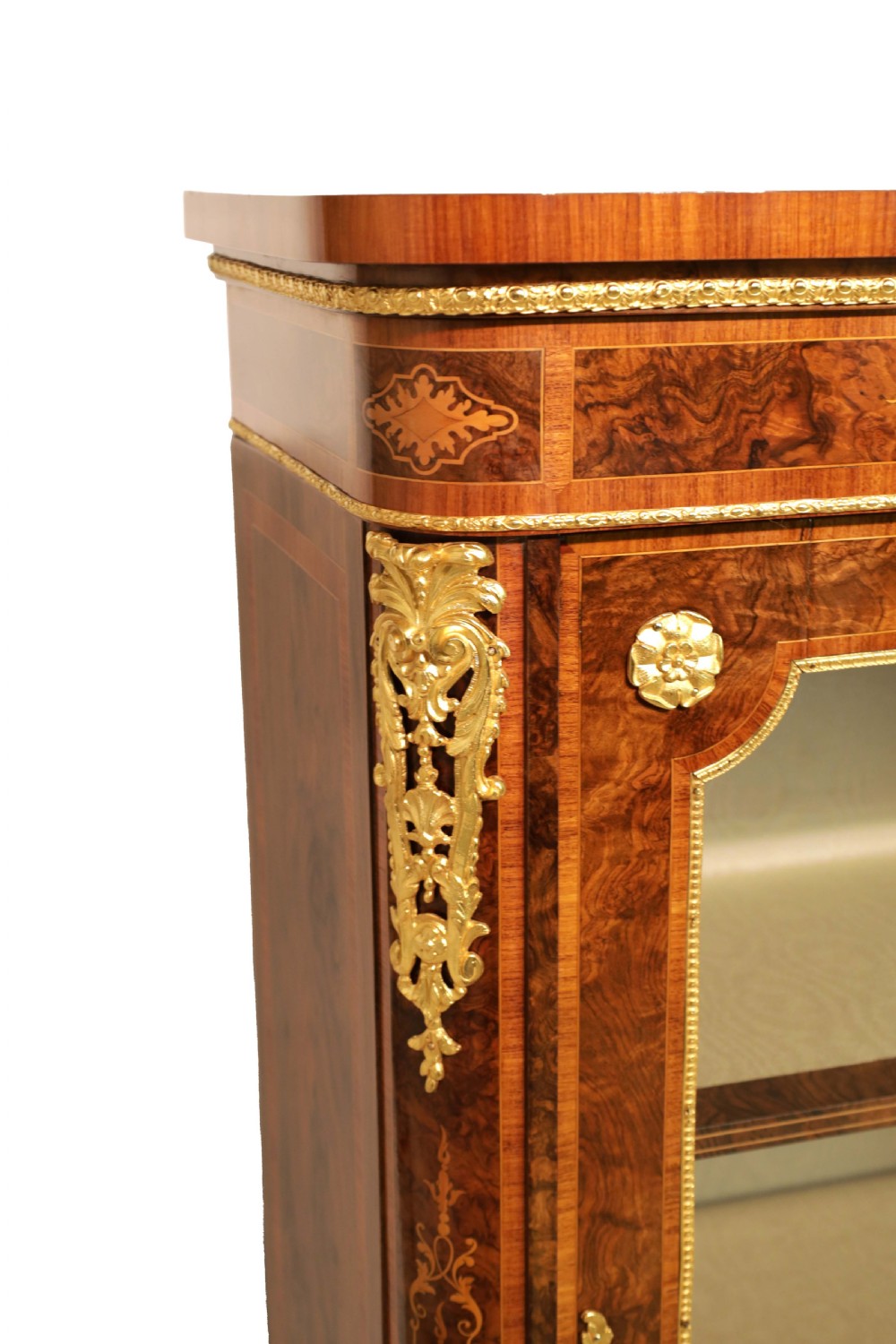 A pair of late nineteenth-century glazed display cabinets crafted from kingwood and walnut with decorative gilt-bronze mounts. View IV